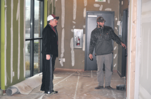 Excel Physical Therapy’s Mike Obergottsberger and Locker Room Fitness co-owner Jake Locker explore the location that will soon be occupied by Excel Physical Therapy at Locker Room Fitness. (Brent Lindquist/Ferndale Record)